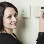 woman with a thermostat