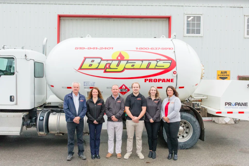 The team at Bryan's Fuel standing by in front of a Bryan's Fuel truck.