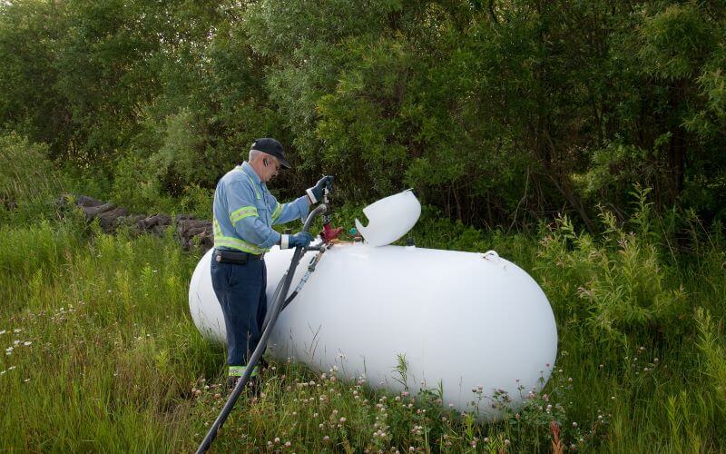 Large 400 Pound Propane Tank in the Yard of a Rural Home Stock