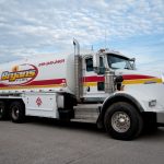 A photo of a Bryan's Fuel truck in a parking lot.