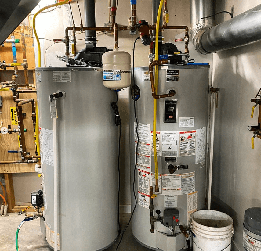 A photo of new water tanks in a basement.