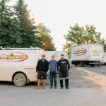 Bryan's Fuel HVAC Install Technicians standing in front of a Bryan's Fuel van.