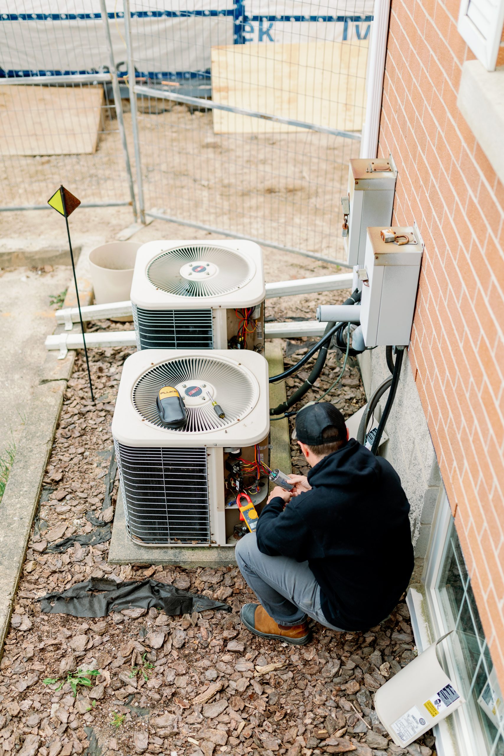 Bryan's Fuel technician working on a heat pump.