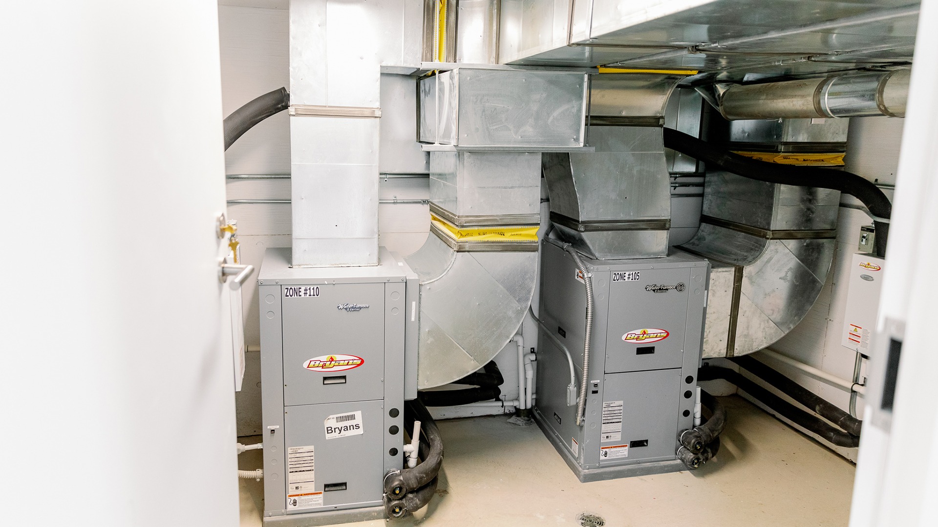 The image shows an industrial HVAC system in a utility room with ductwork and labeled equipment for zones #110 and #105.