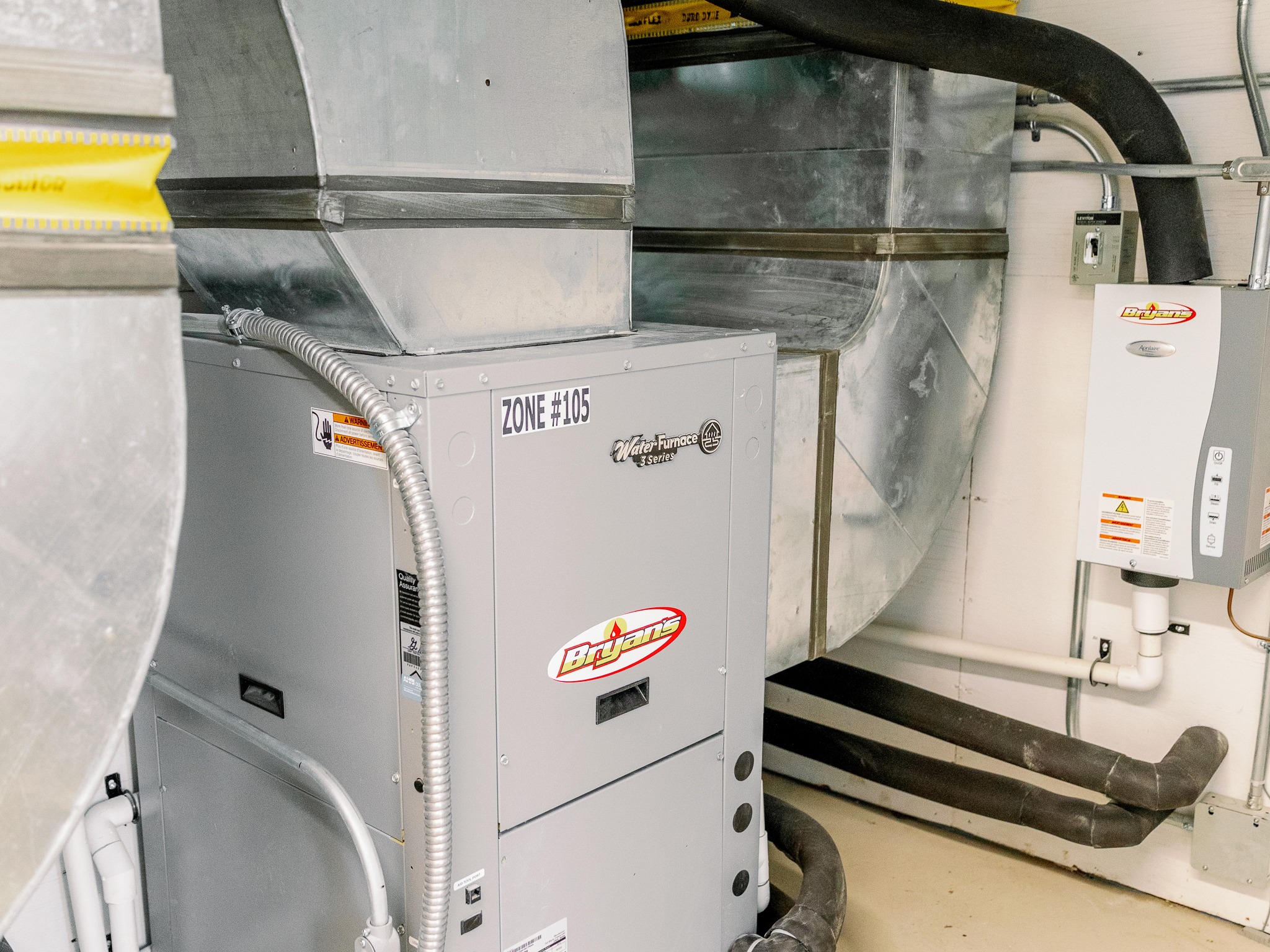 The image shows an industrial HVAC system with ducts and control panels in a utility room labeled "ZONE #105."