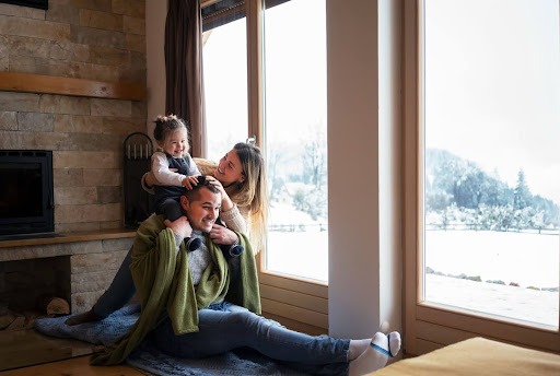 Family staying warm indoors during the winter.