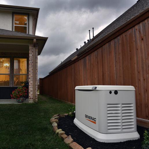 A generac generator outside a home.