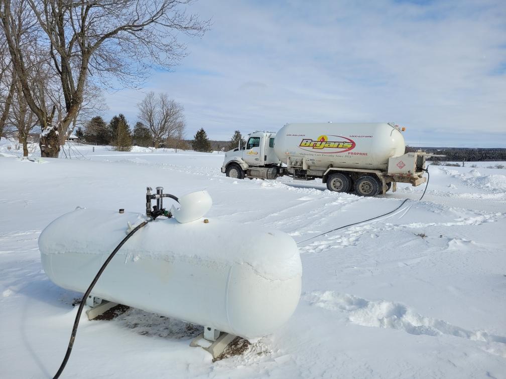 Propane truck with a winter propane delivery in the snow.