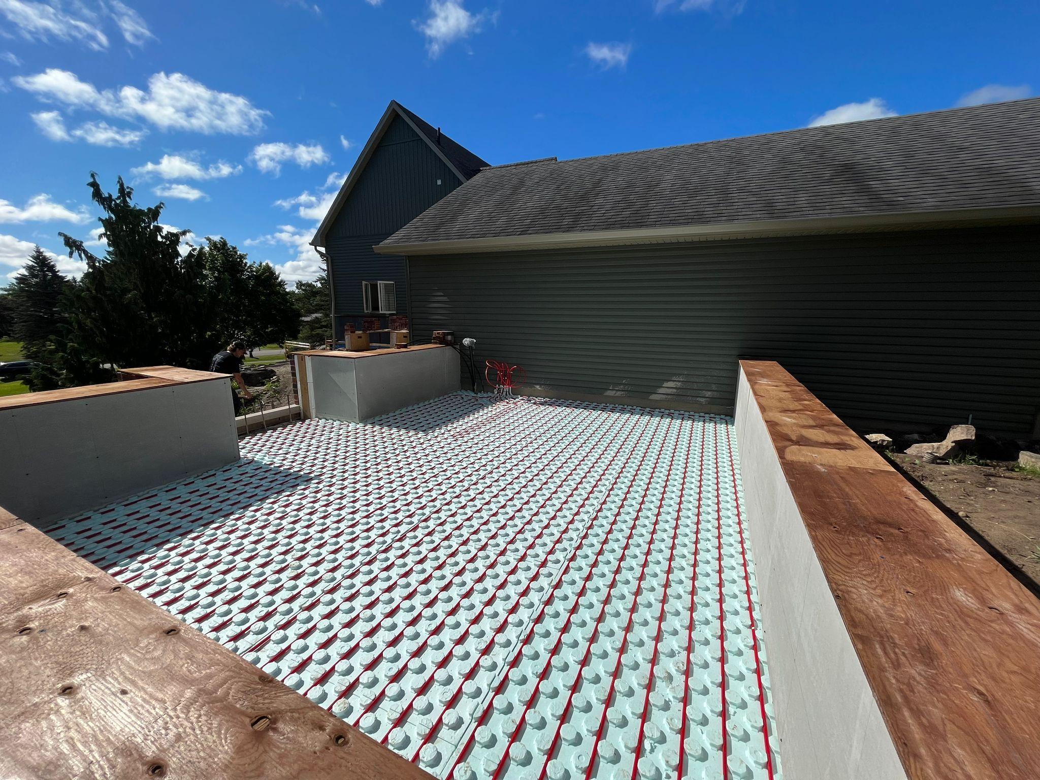 Heated flooring being installed.