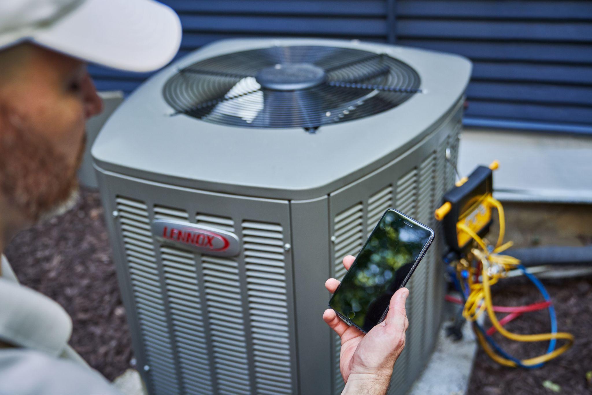 Servicing an air conditioner.