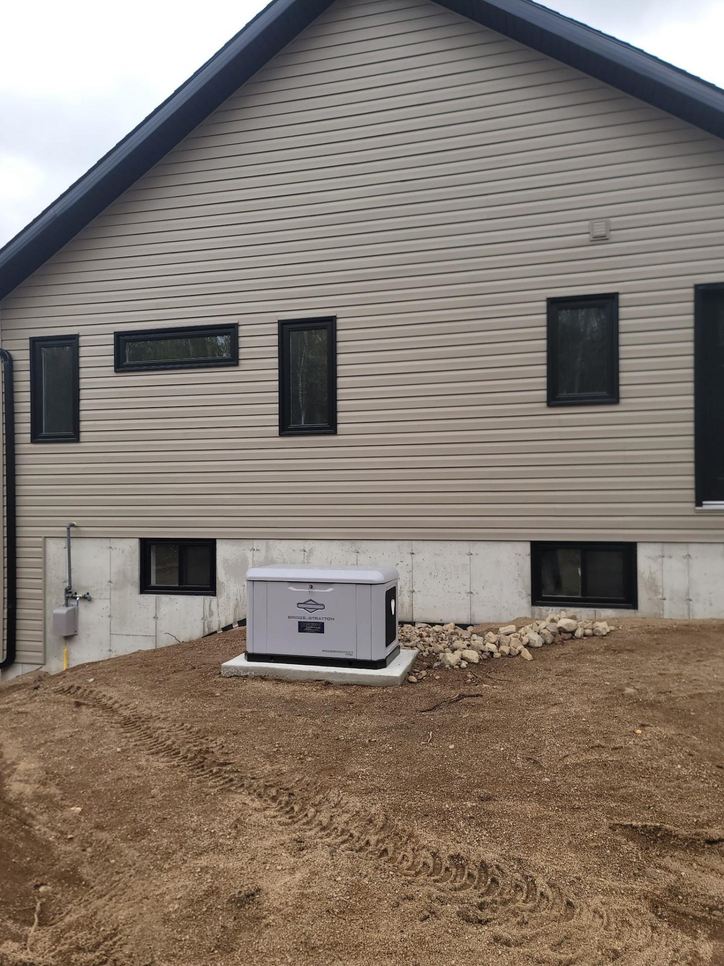 Home generator outside a new home build.